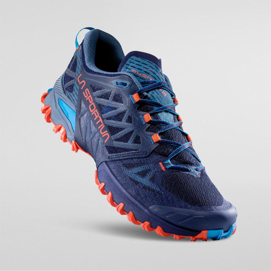 Bushido III trail running shoe with aggressive tread and breathable mesh for stability and grip.