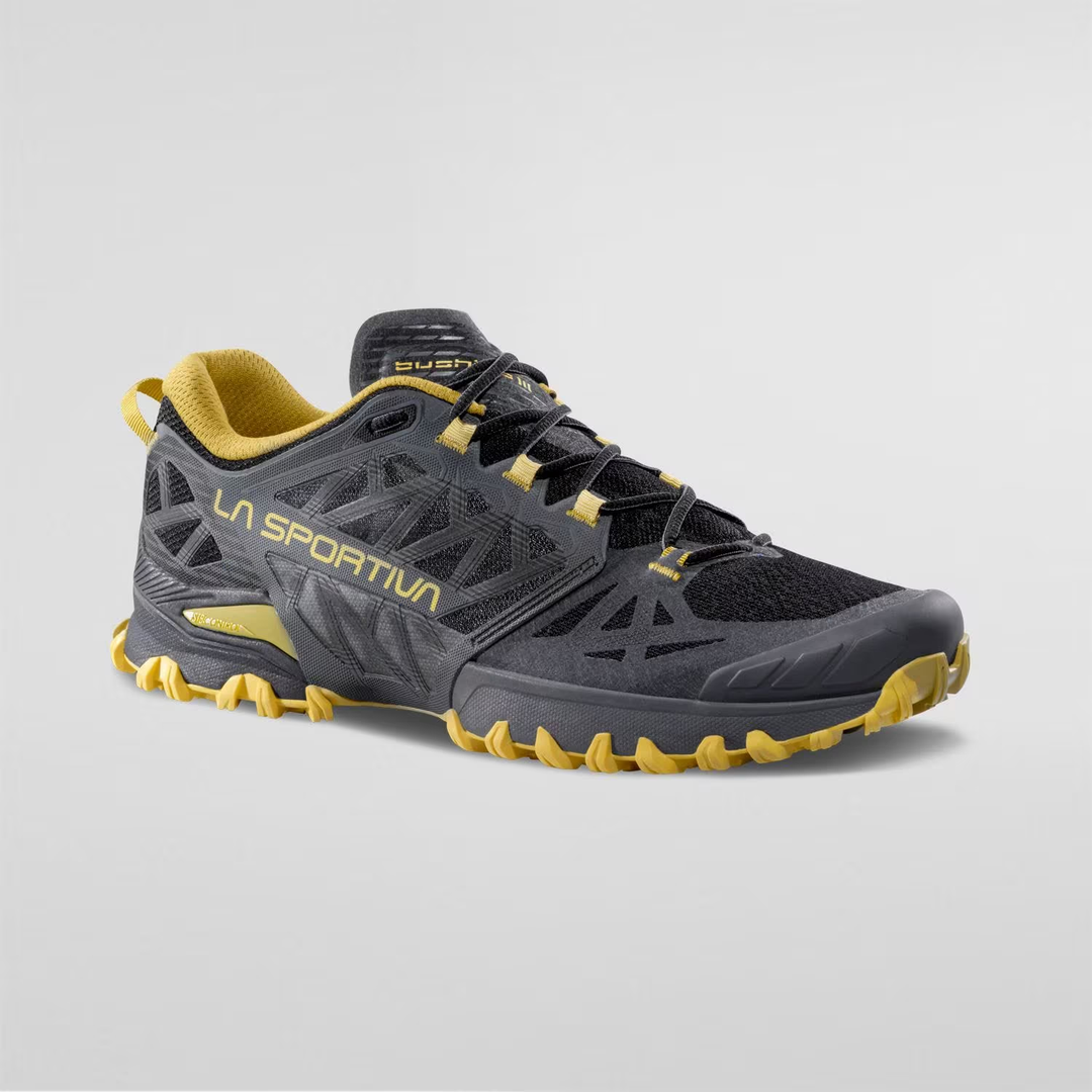 Trail running shoe Bushido III with black and yellow design, enhanced grip, and breathable side panels.