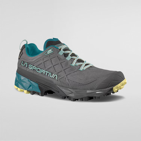 Gray Akyra II Woman GTX trail running shoe with GORE-TEX, 3D Grid construction, and impact brake system for all-weather conditions.