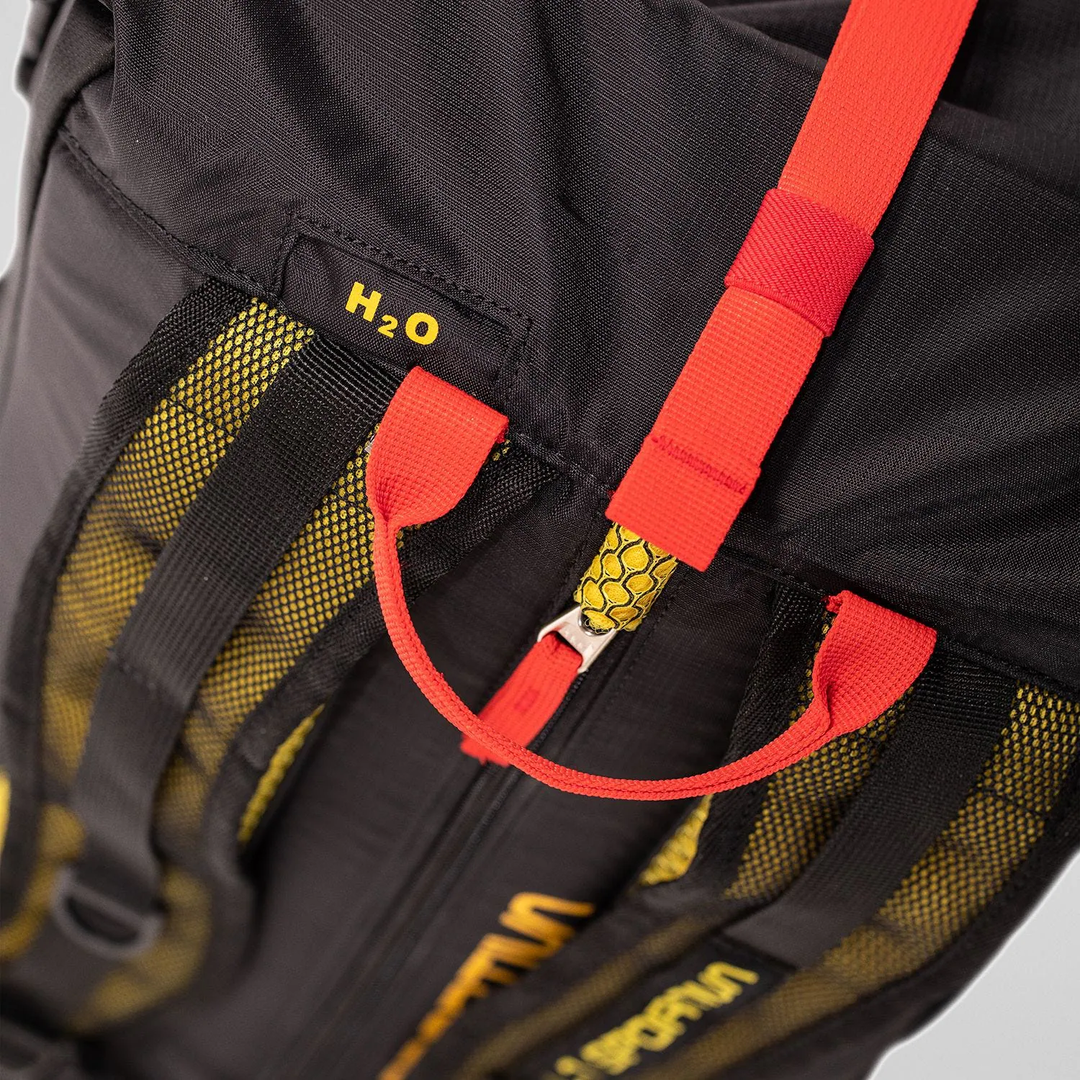Alpine Backpack with reinforced nylon, hydration system compatibility, and external ice axe holder.
