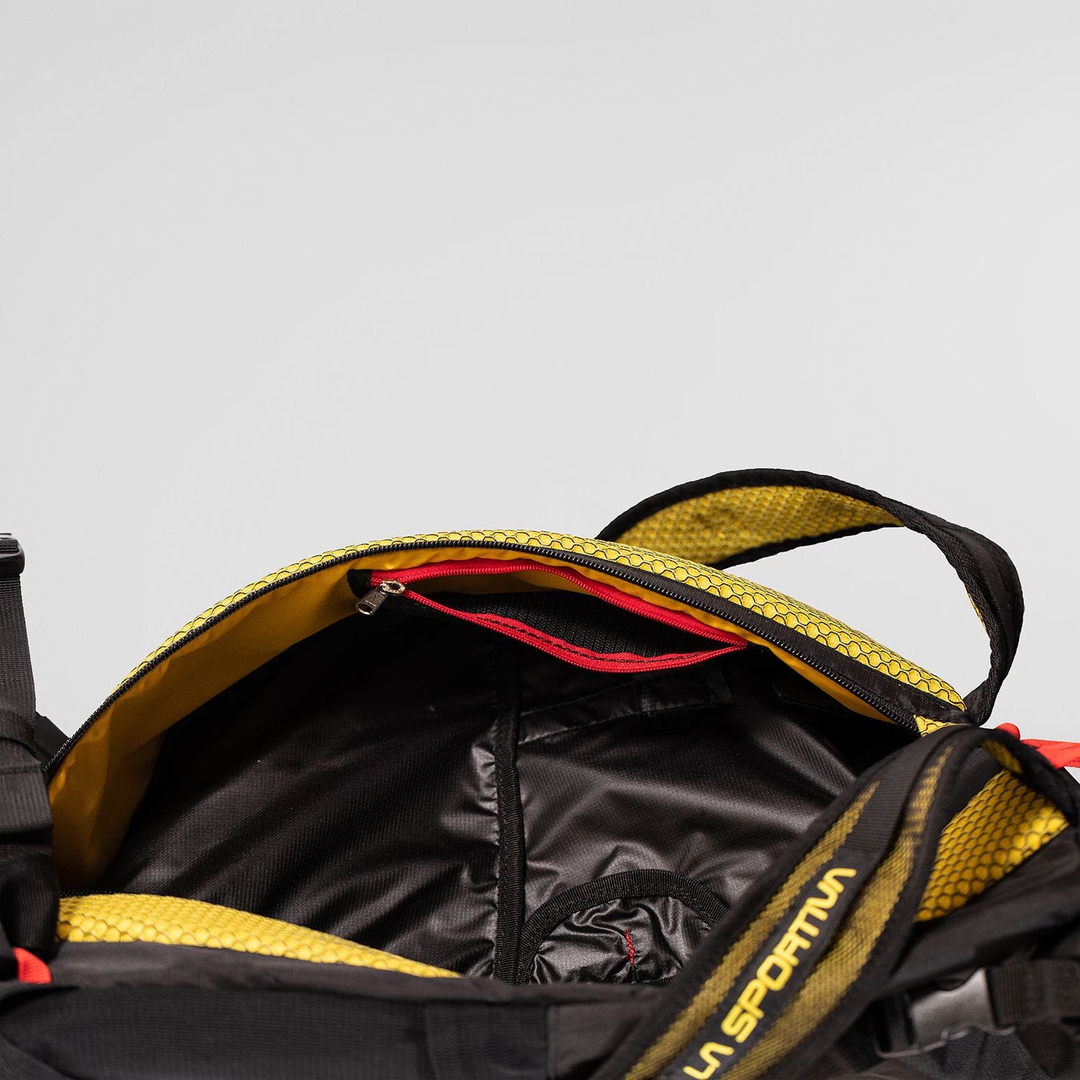 Alpine Backpack with reinforced nylon mesh, internal storage, and external ice axe holder.