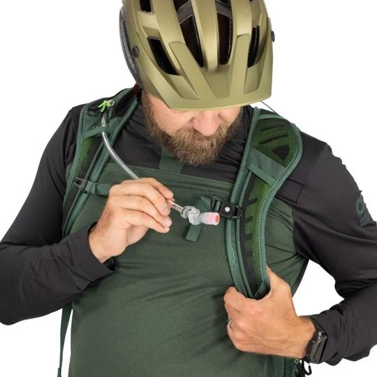 Raptor 10 hydration backpack in use during mountain biking.
