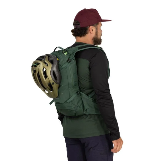 Raptor 10 hydration backpack in green with ergonomic harness and helmet attachment, shown on cyclist.
