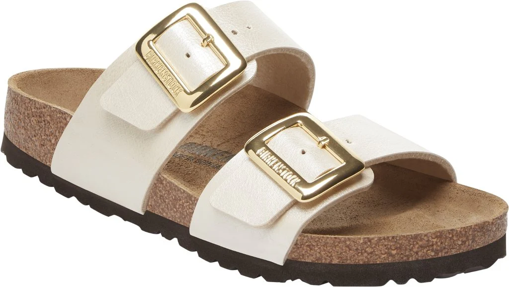 Sandals with cork-latex footbed, white Birko-Flor straps, and adjustable metal buckles.