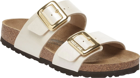 Sandals with cork-latex footbed, white Birko-Flor straps, and adjustable metal buckles.