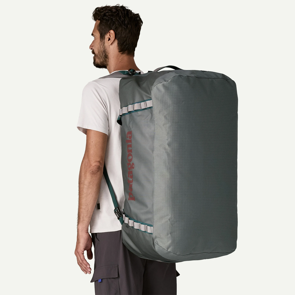Black Hole Duffel 100L large waterproof recycled duffel bag with removable shoulder straps and padded bottom