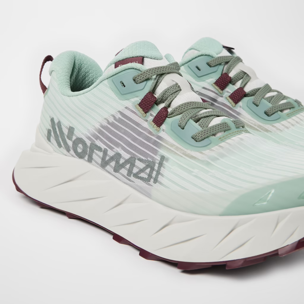 Cadí M trail running shoe with engineered mesh, Vibram Megagrip sole, and soft cushioning for smooth and hilly terrains