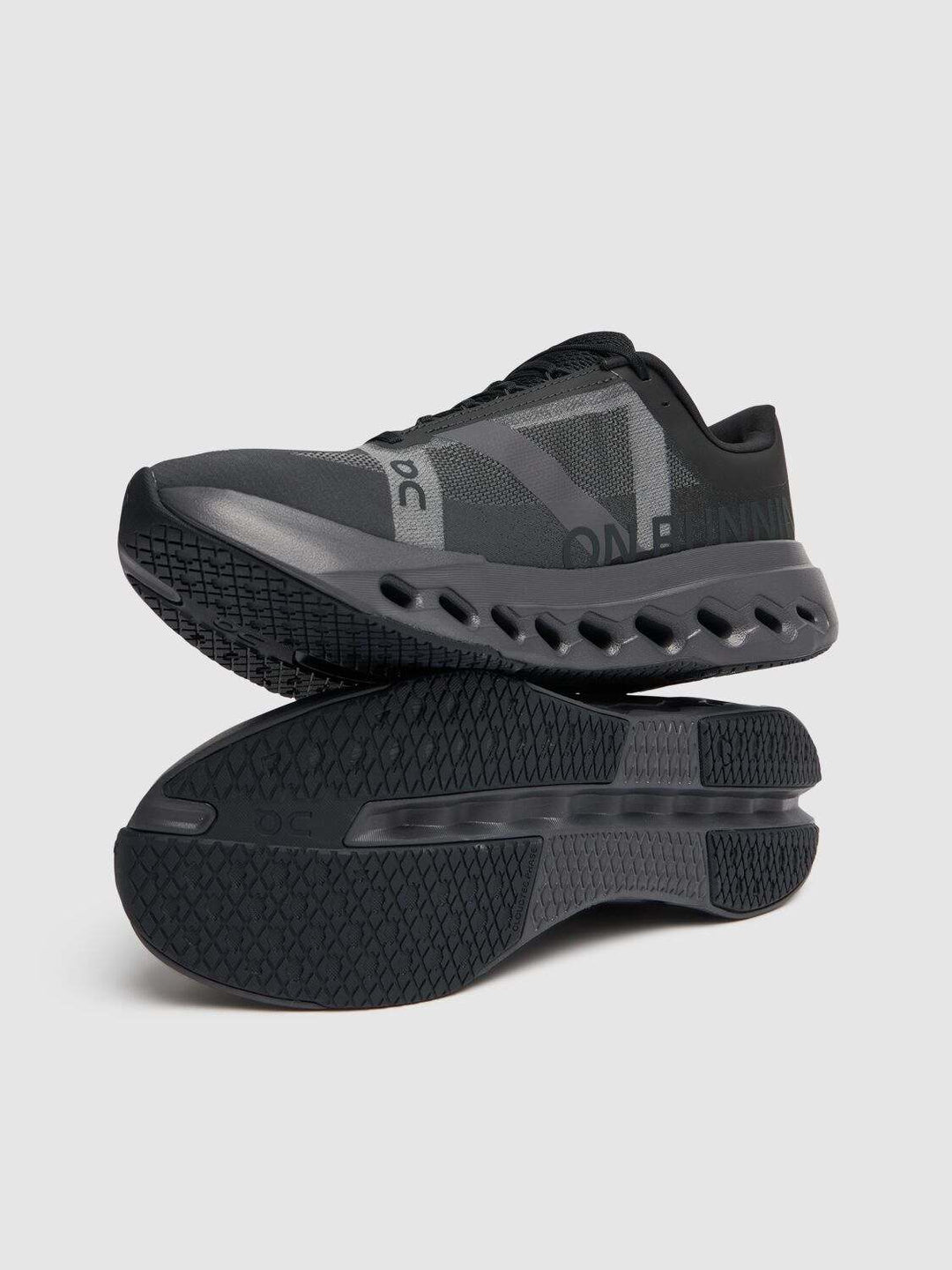 Cloudsurfer Next W black athletic running shoes with cushioned soles.