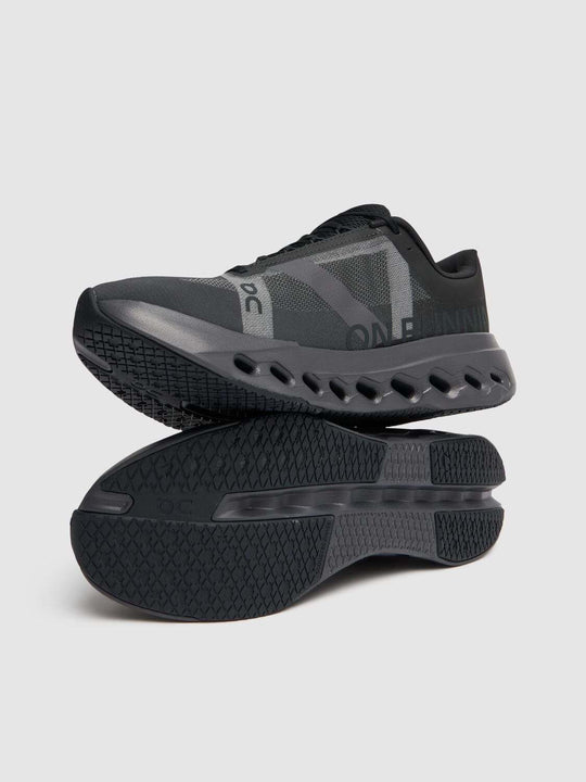 Cloudsurfer Next W black athletic running shoes with cushioned soles.
