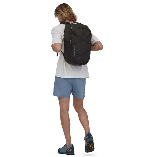 Refugio Day Pack 30L on person, outdoor use, black color, Fair Trade Certified, recycled materials.