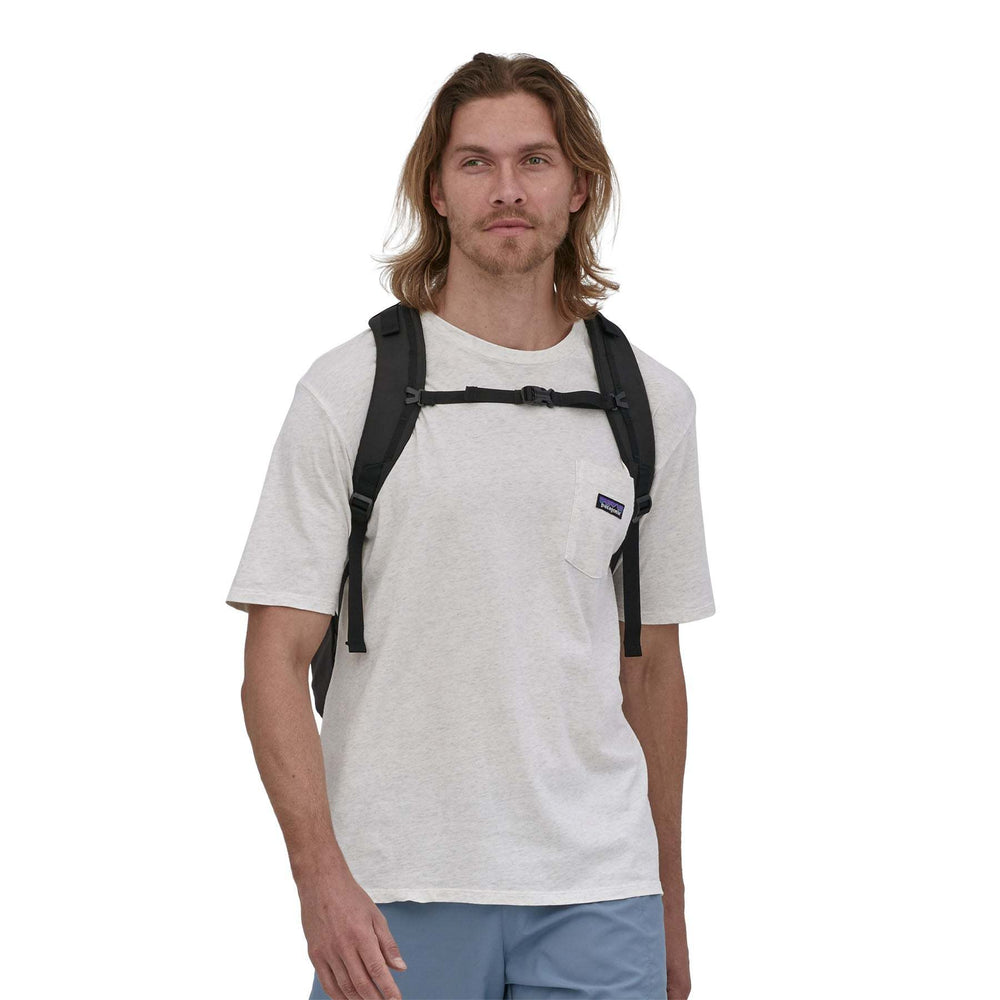Man wearing Refugio Day Pack 30L backpack.