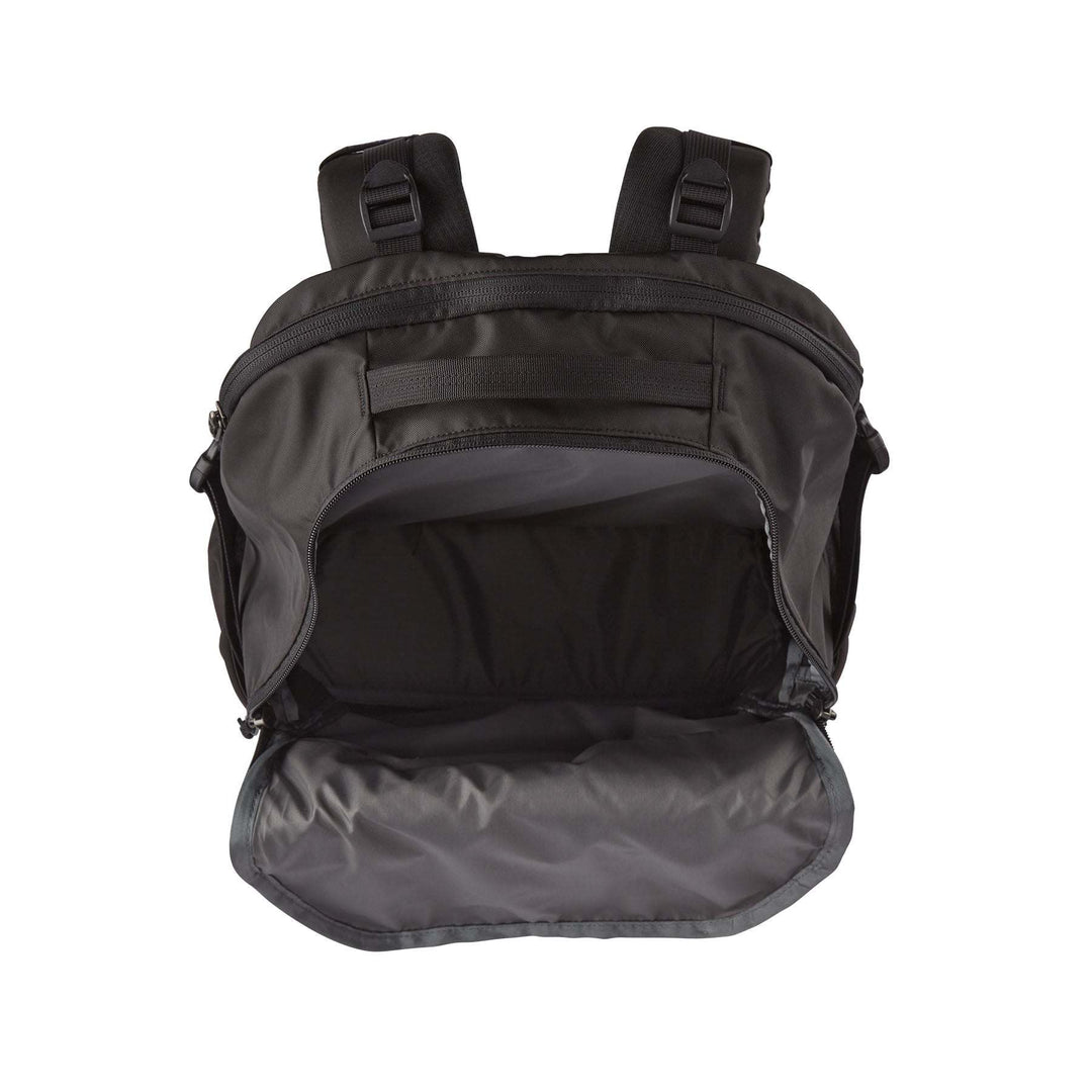 Refugio Day Pack 30L open view showing spacious interior and adjustable straps.