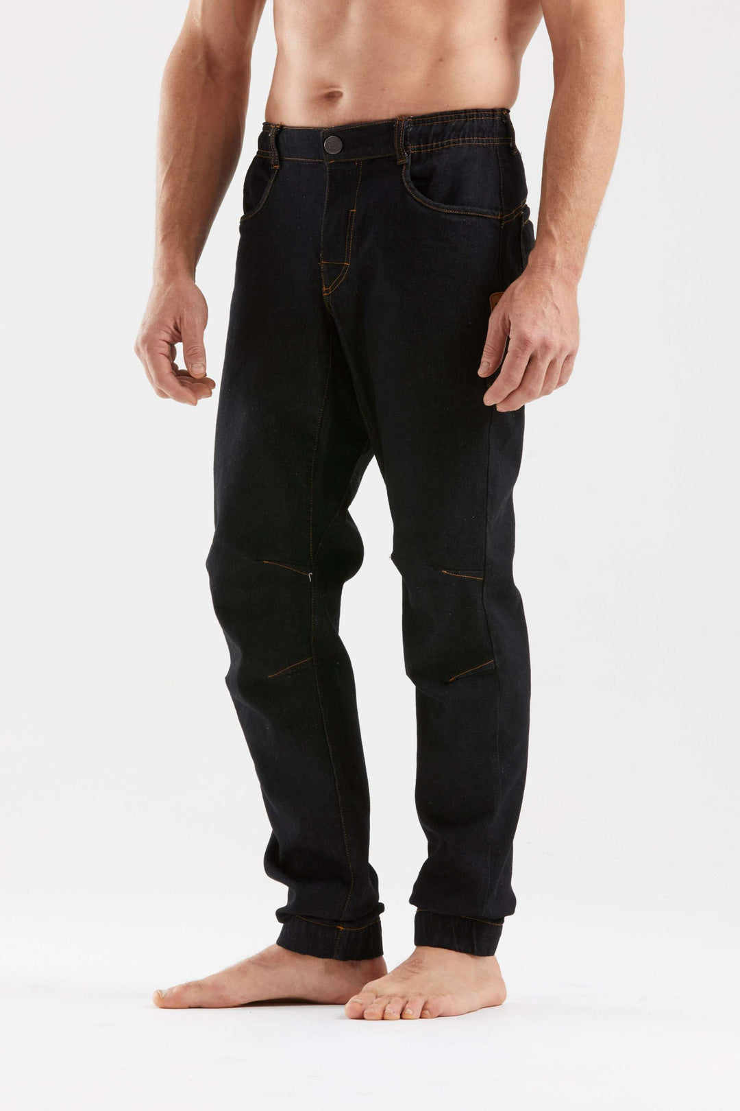 Denim climbing pants with elastic waistband and adjustable cuffs.
