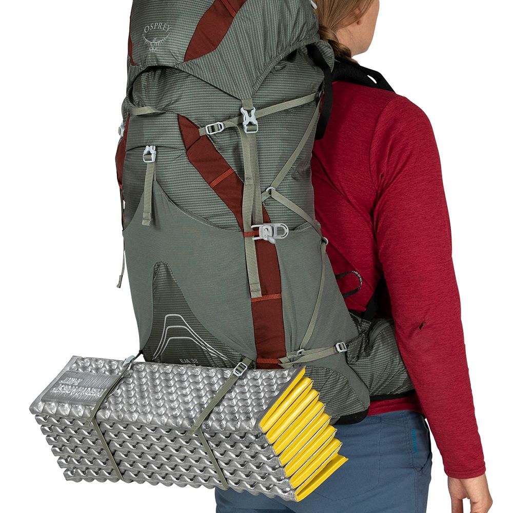 Lightweight women's hiking backpack Eja 38 with camping mat attached.