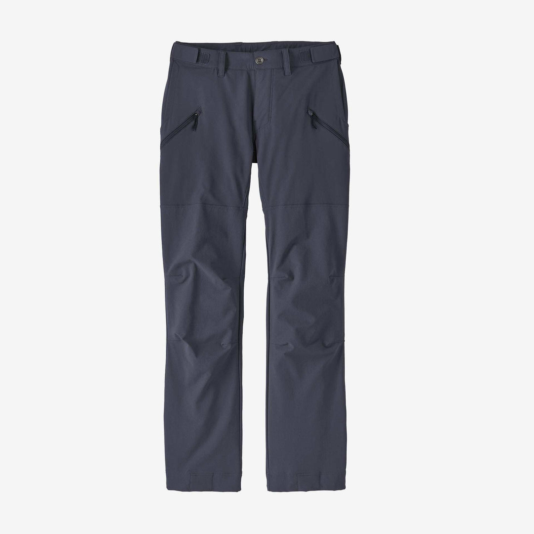 Women's Point Peak Trail Pants in dark color, showcasing slim fit and zippered pockets on a white background.