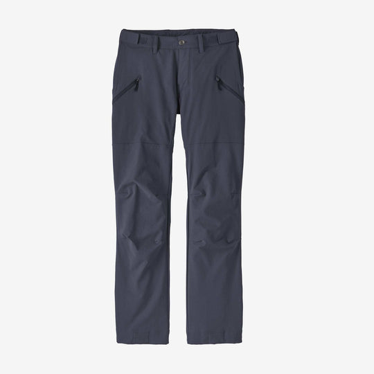 Women's Point Peak Trail Pants in dark color, showcasing slim fit and zippered pockets on a white background.