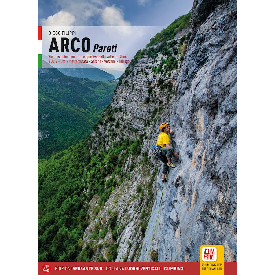 Climber scaling a steep rock face in Arco Pareti mountain area with scenic valley background