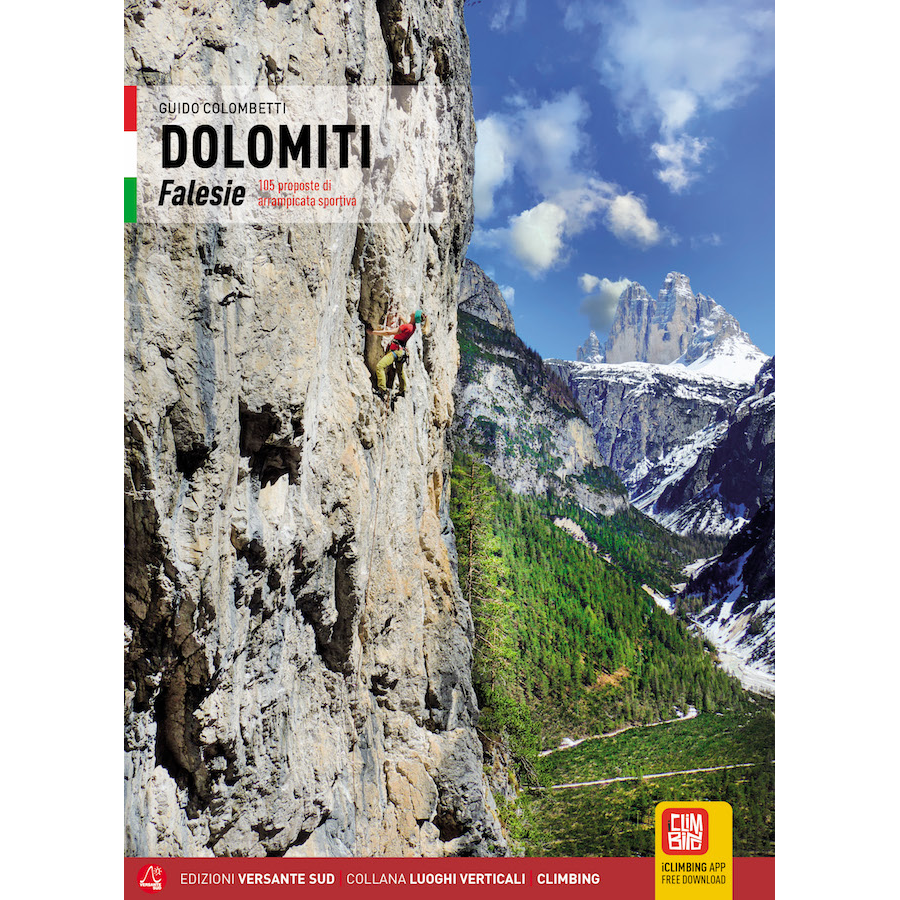 Climber scaling steep rock face in Dolomiti Falesie with mountainous landscape in background